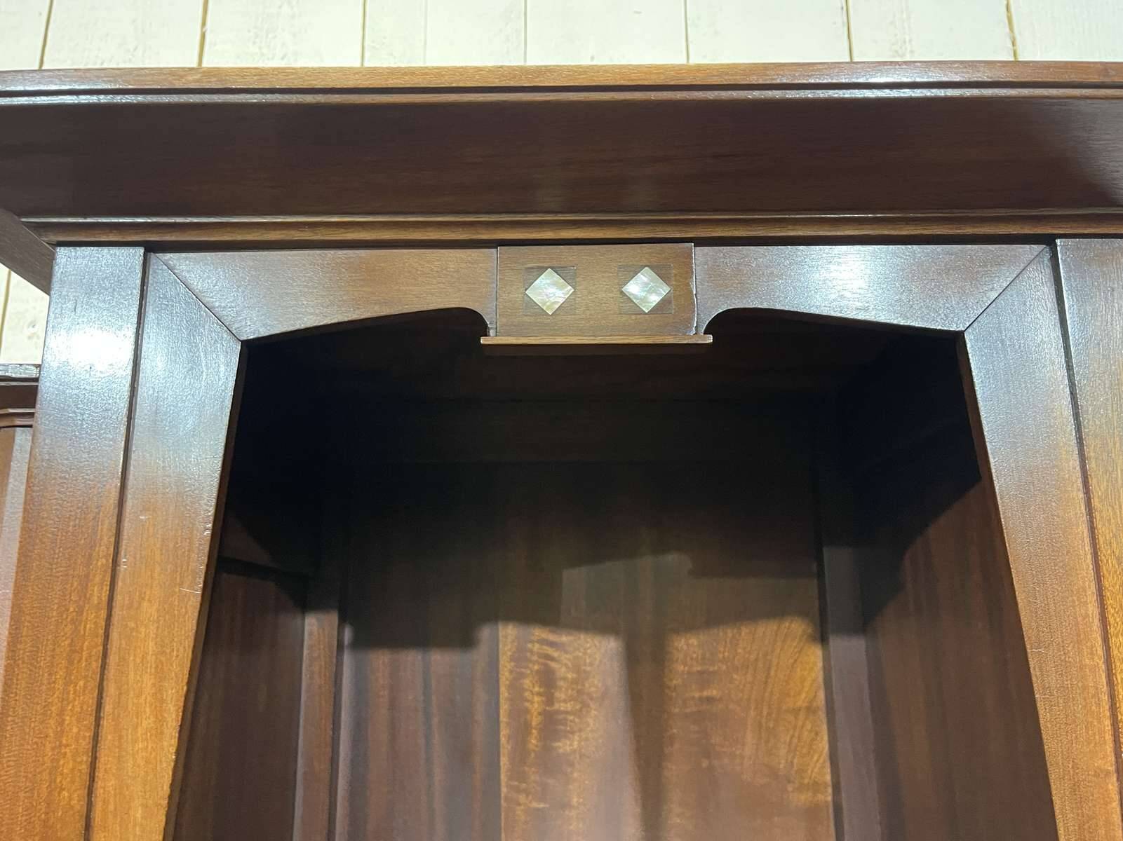 Art Nouveau mahogany buffet with clock in the style of G. Serrurier Bovy.