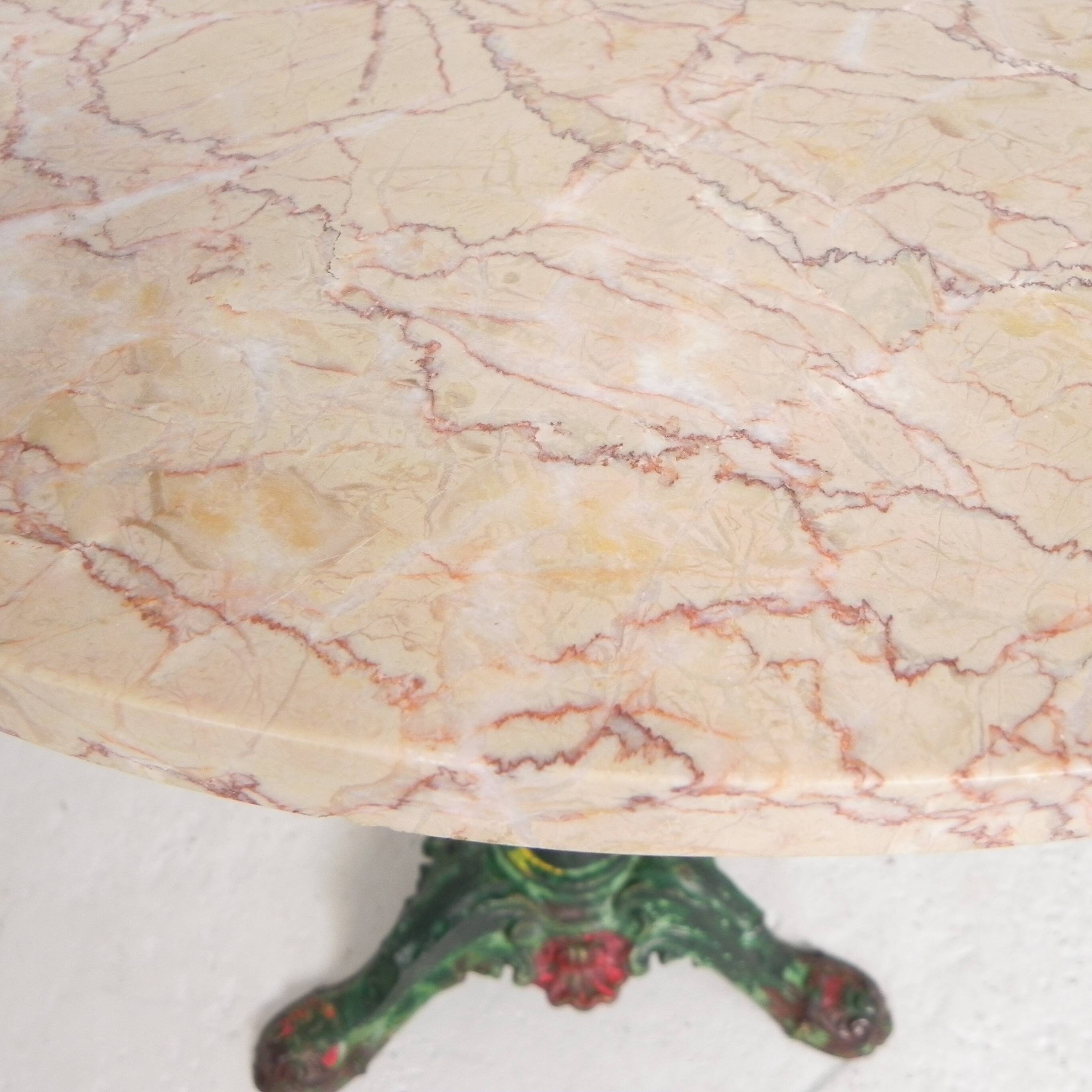 Bistro table with cast iron legs and marble top, 1920s.