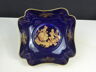 Blue Limoges porcelain cup with golden highlights decorated with a gallant scene