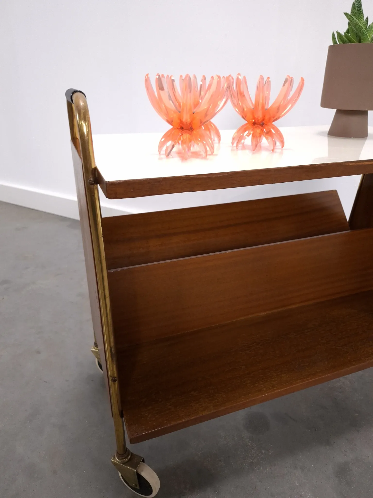 Vintage 1950s side table with a reading basket, formica top, teak wood.