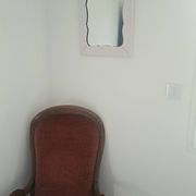 Mid-20th century rectangular wall mirror with a powder pink frame.