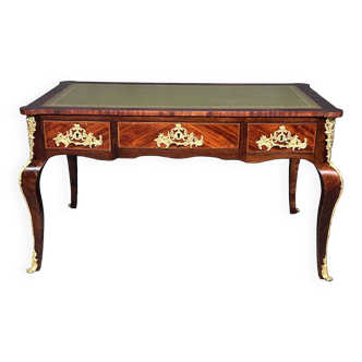 Louis XV style desk. Rosewood veneer, gilded bronze decoration, leather.