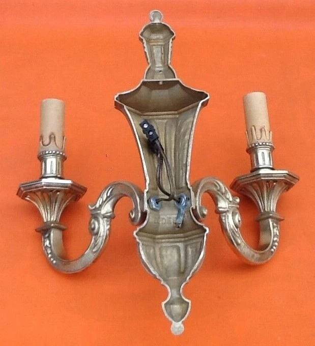 Large wall sconce in LXV style, patinated bronze.