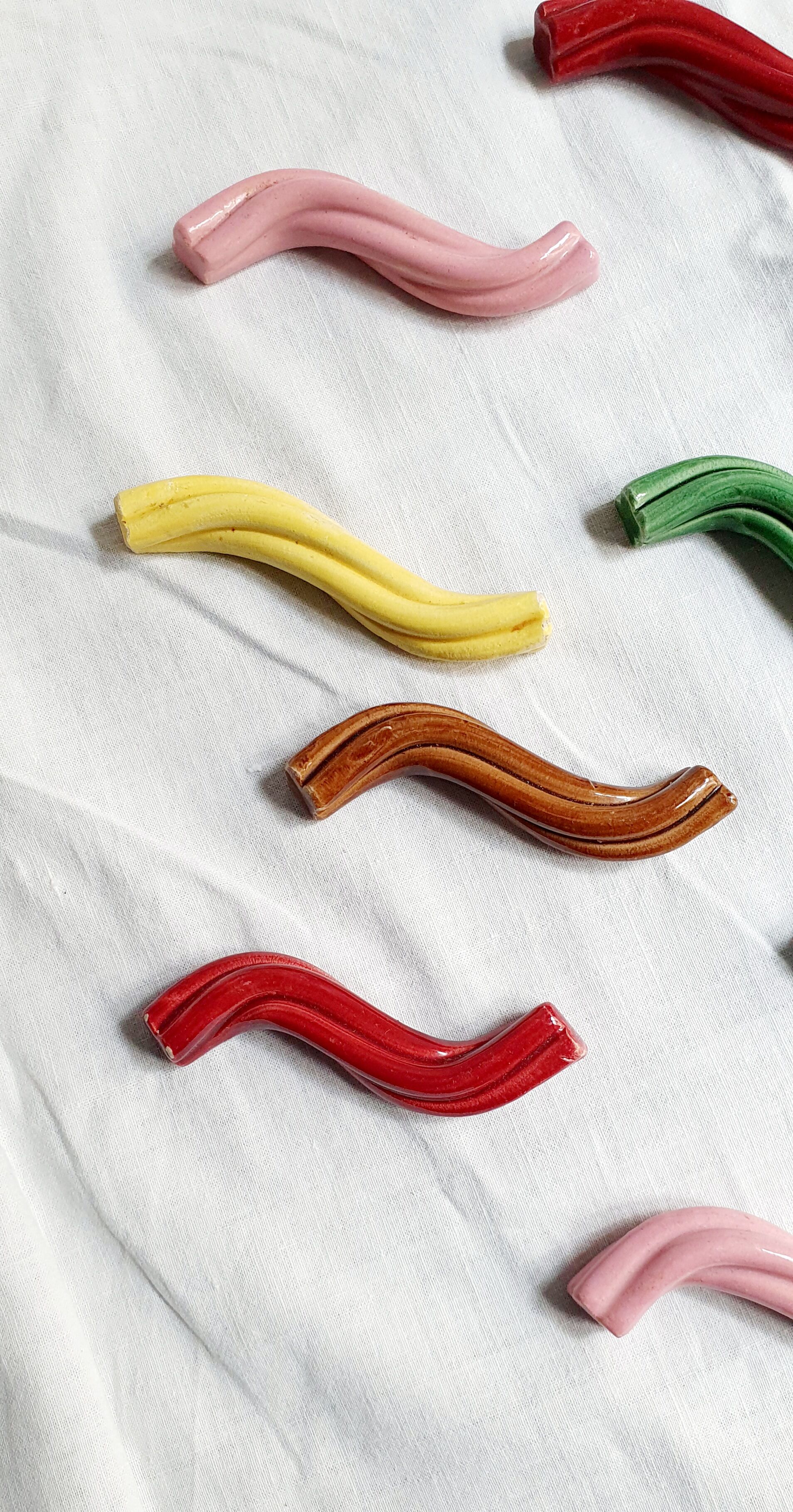 Set of 9 enamelled ceramic knife holders