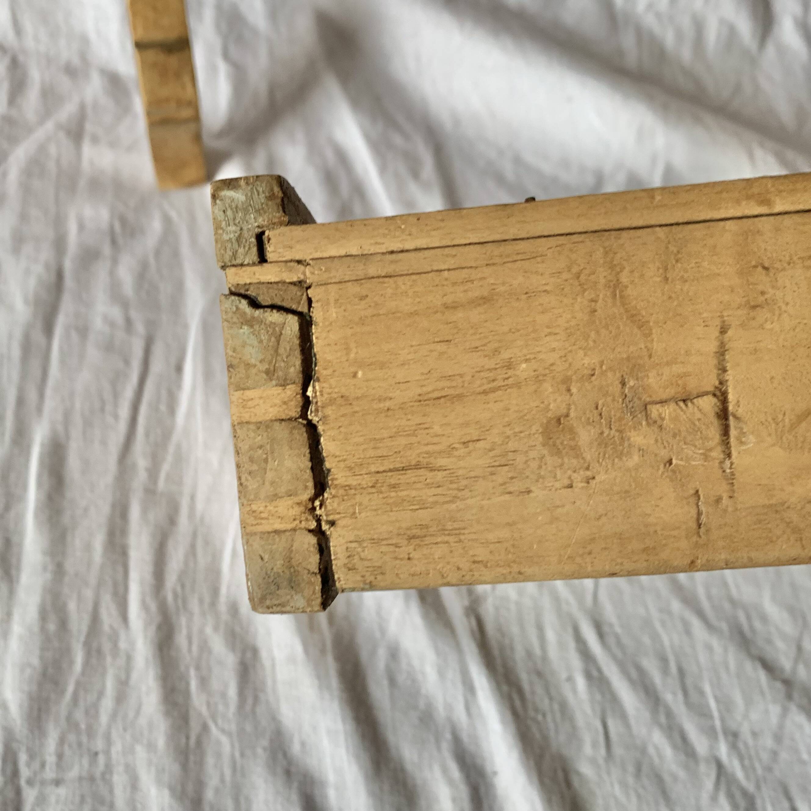 Old small hanging shelf in solid wood