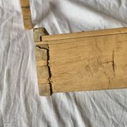 Old small hanging shelf in solid wood