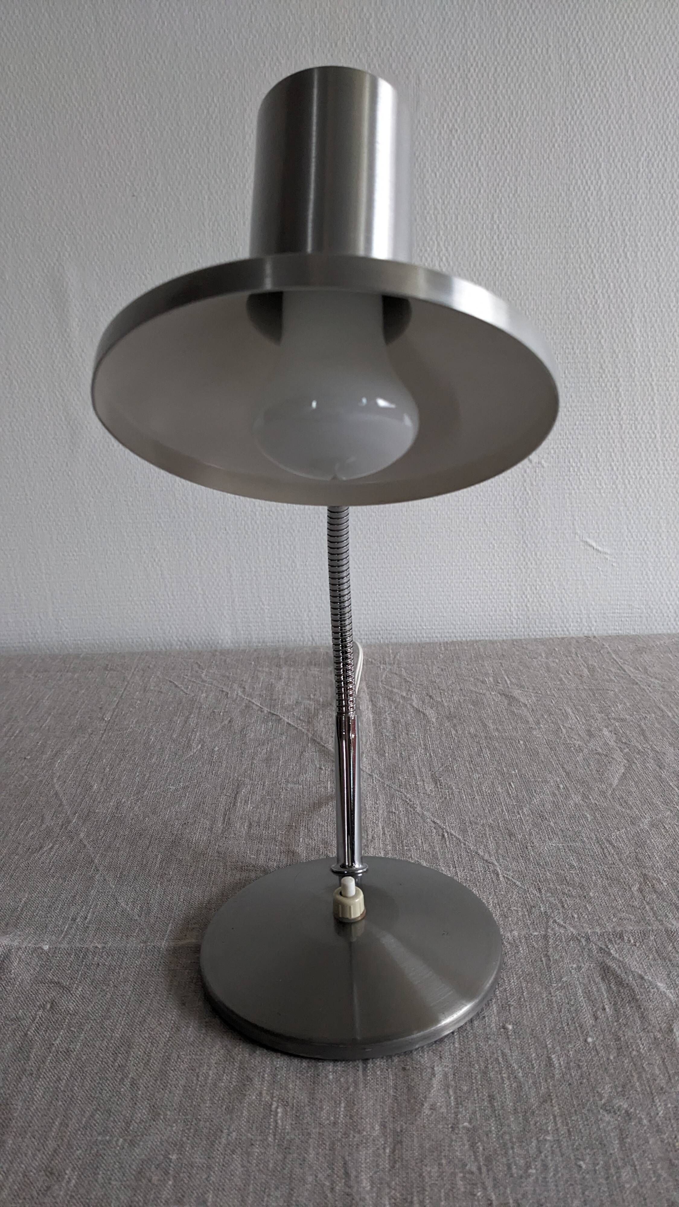 Articulated bedside lamp or wall light in aluminium, France circa 1960.