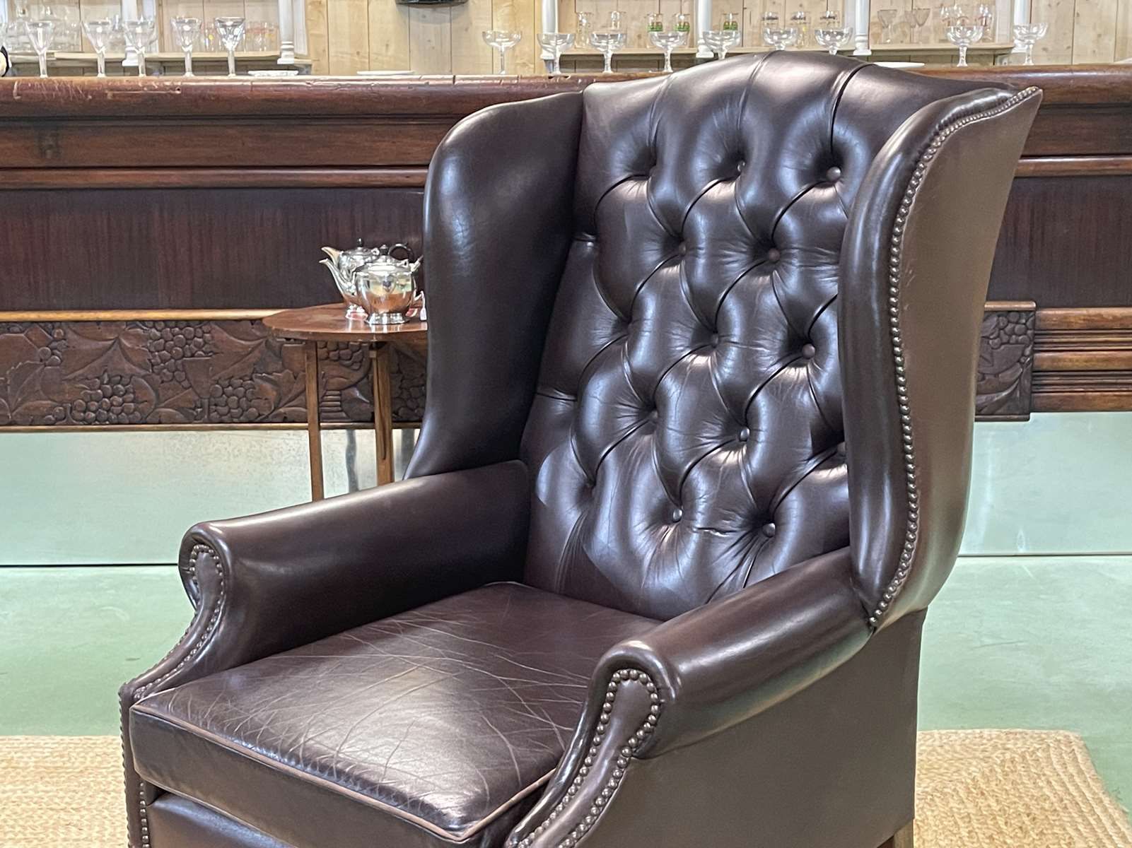 Chesterfield armchair with brown leather ears from the 1990s in very good condition