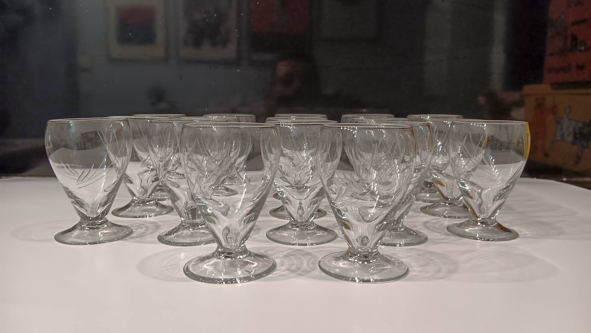 17 small crystal liquor glasses, chiseled pattern - Perfect condition.