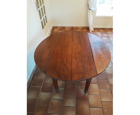 Old round table with flaps