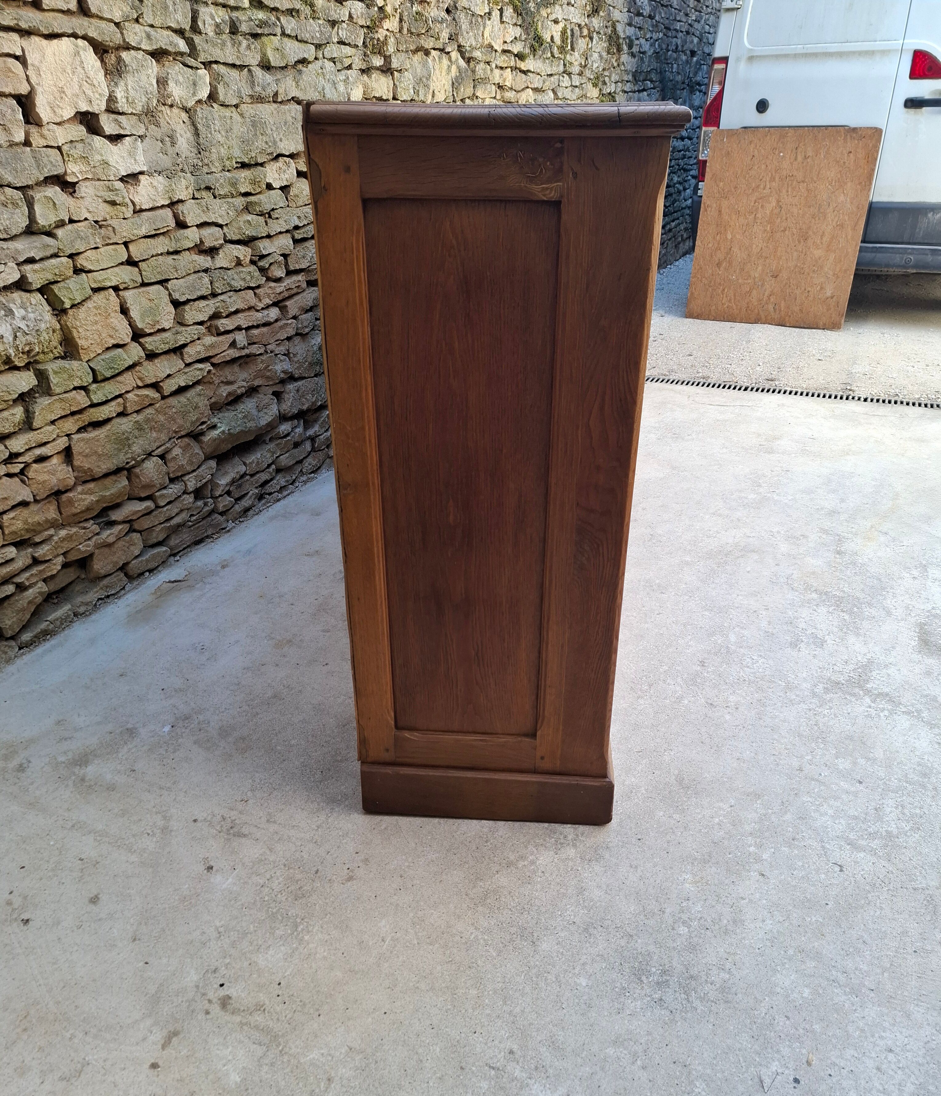 Oak workshop furniture with sliding doors.