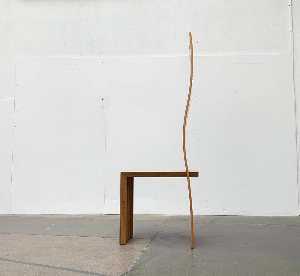 Postmodern chair with a high backrest