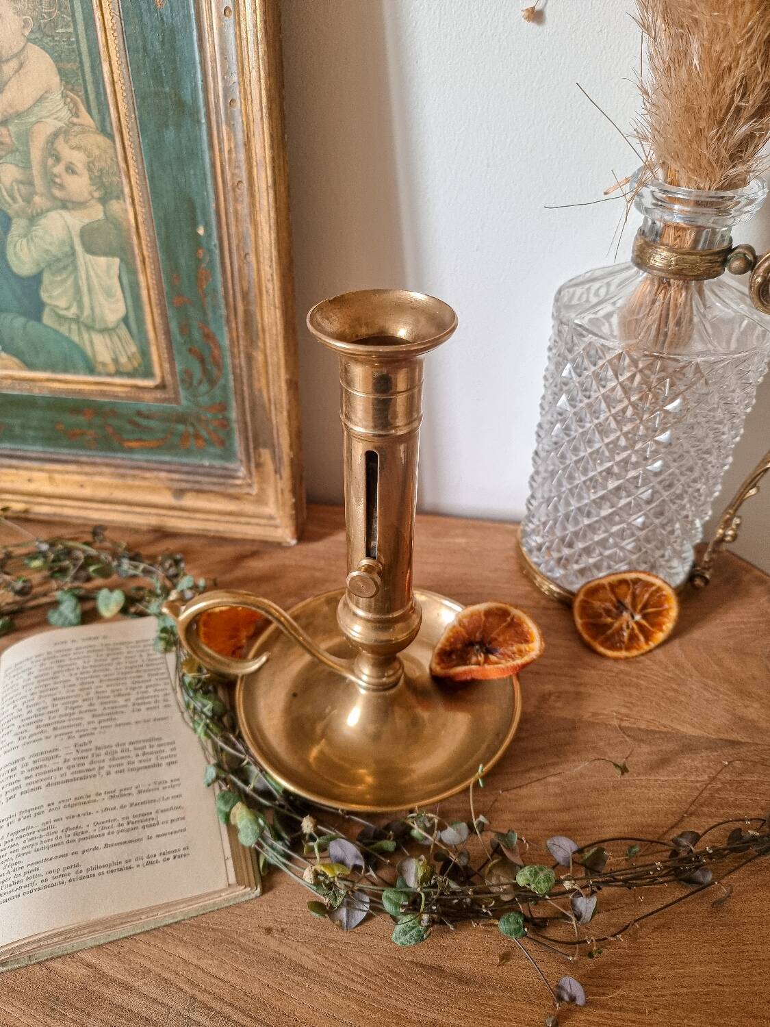 Cellar rat candle holder with brass pusher