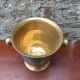 Vintage turquoise brass champagne bucket with grape decoration.