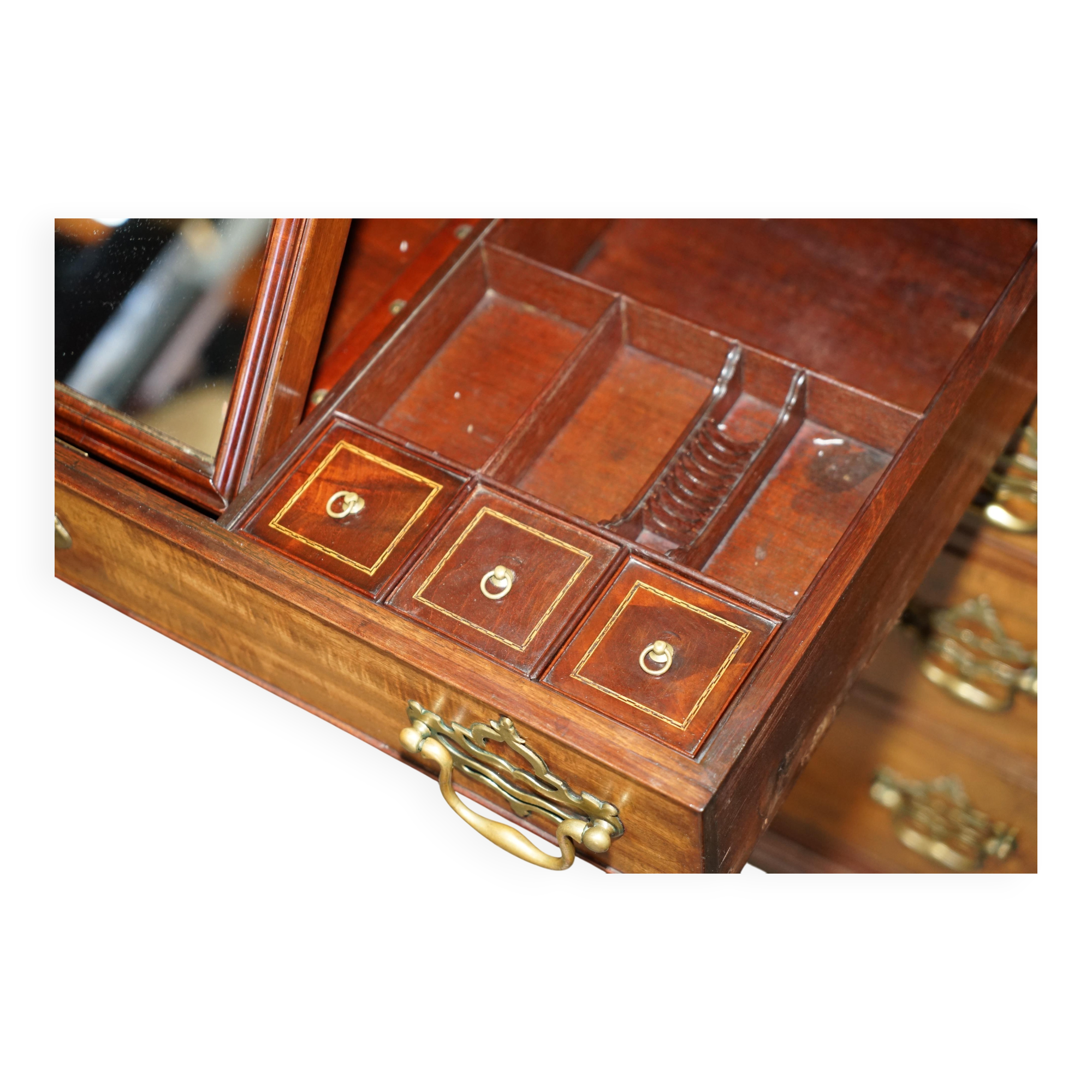 George III commode circa 1770 in walnut by Thomas Chippendale.