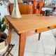 Old wooden desk or side table with compass legs