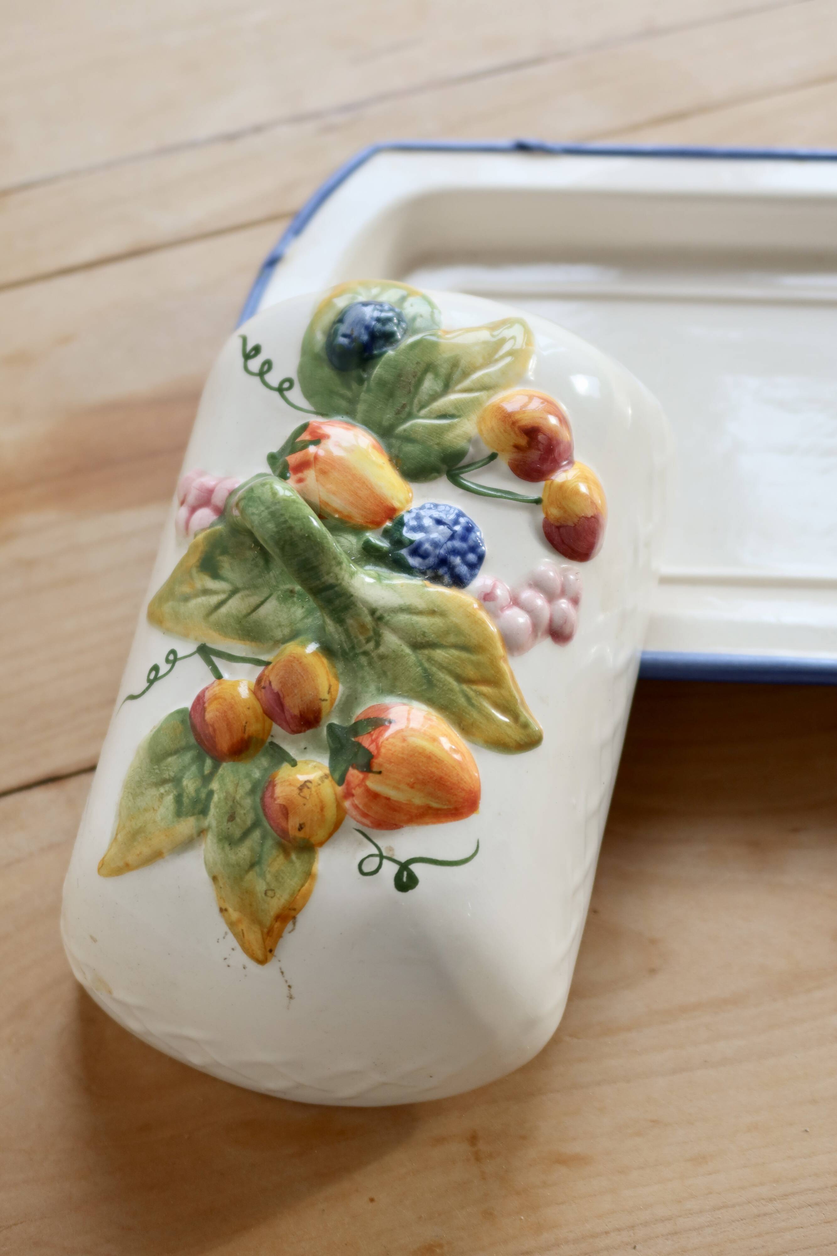 Large vintage faience butter dish with slip decoration – Fruit design