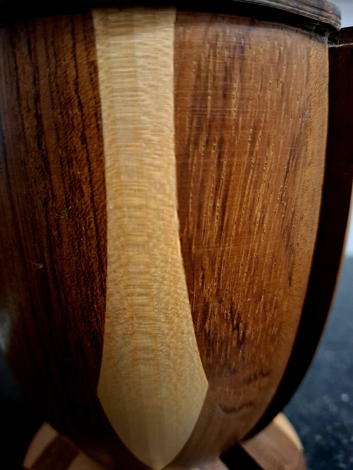 Bookends in exotic wood marquetry in the shape of a tambourine.