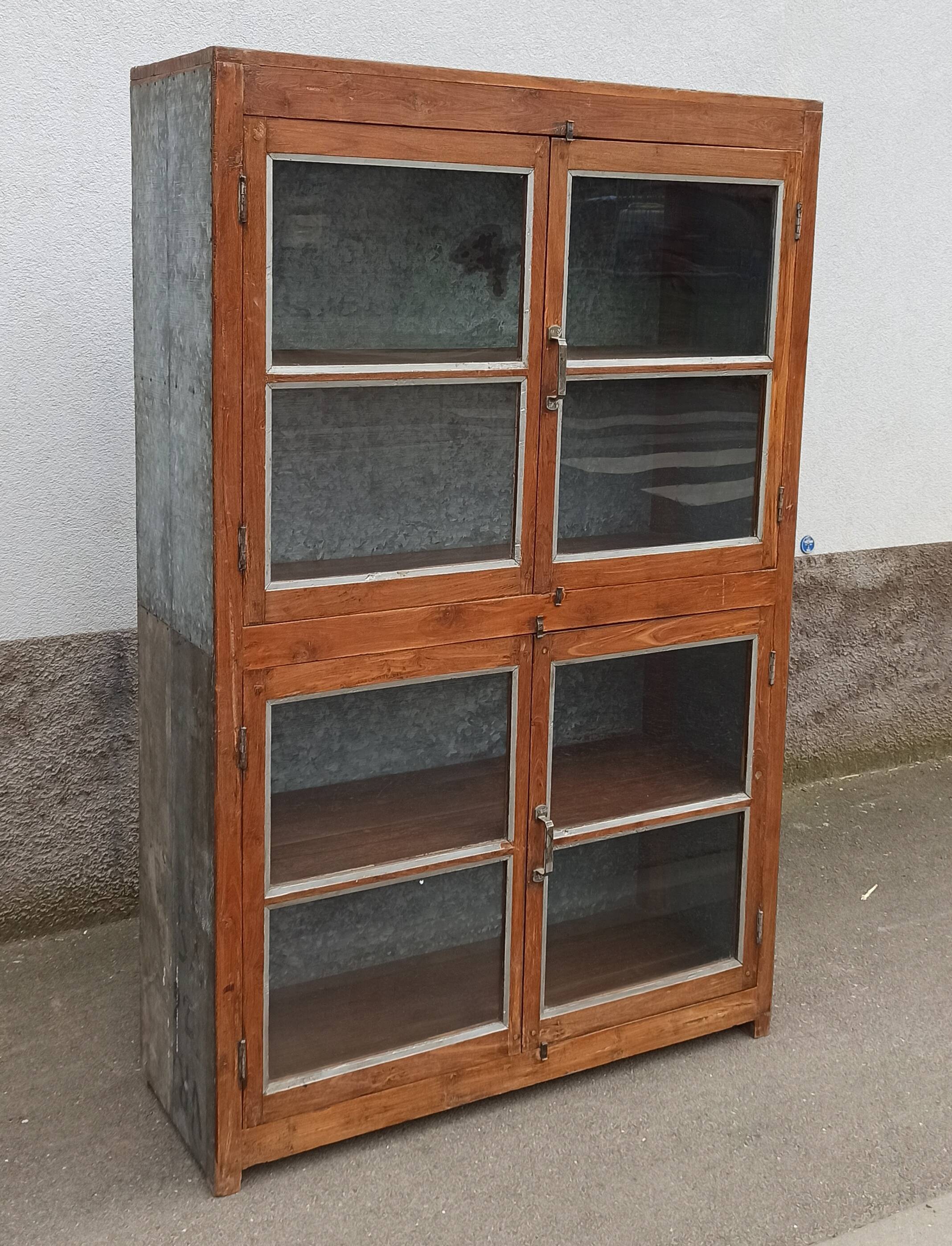 Old glass cabinet in wood and metal