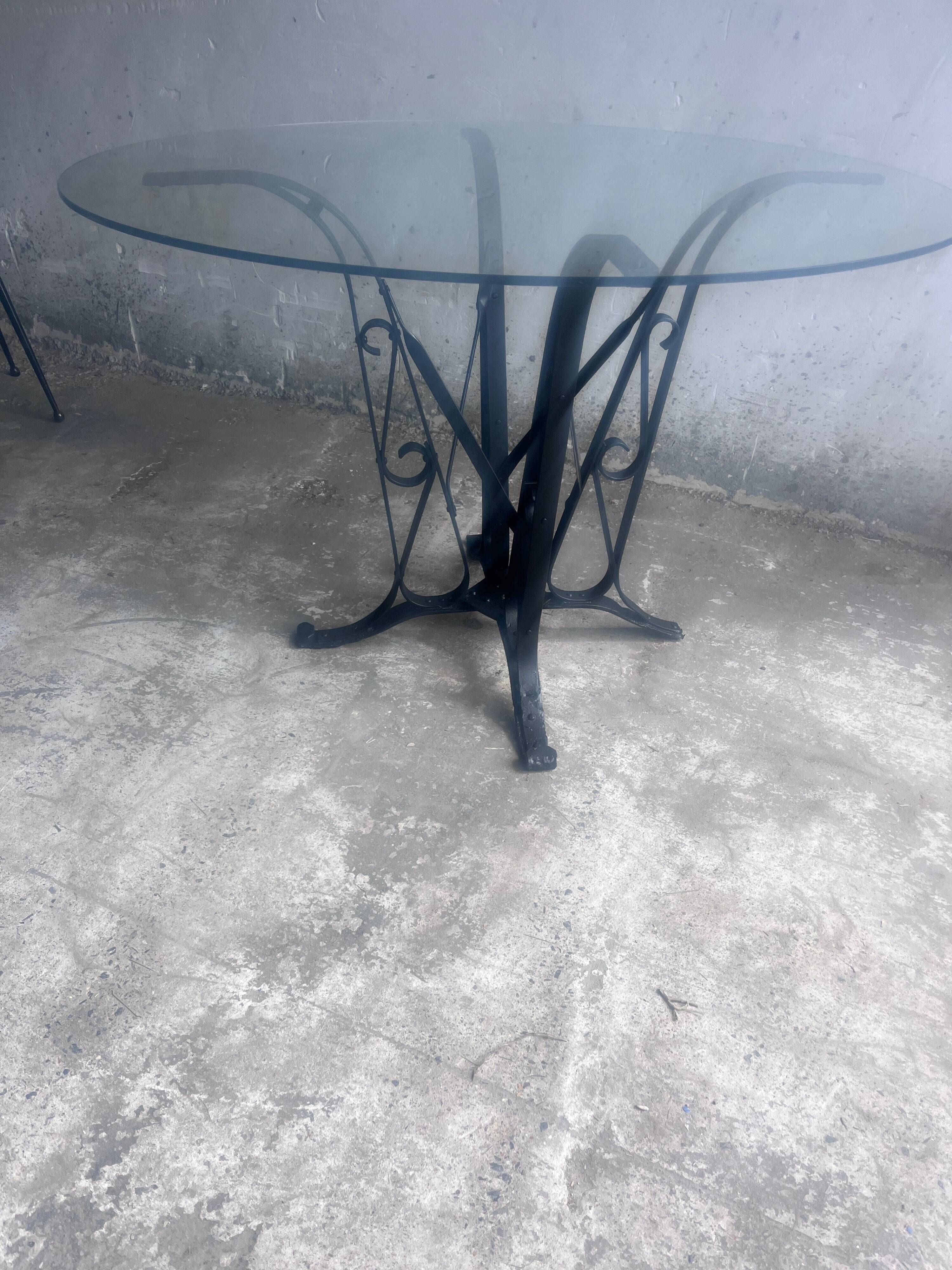 French Art Deco dining table in wrought iron and glass, circa 1930.