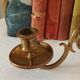 Pair of antique wall-mounted brass candle holders
