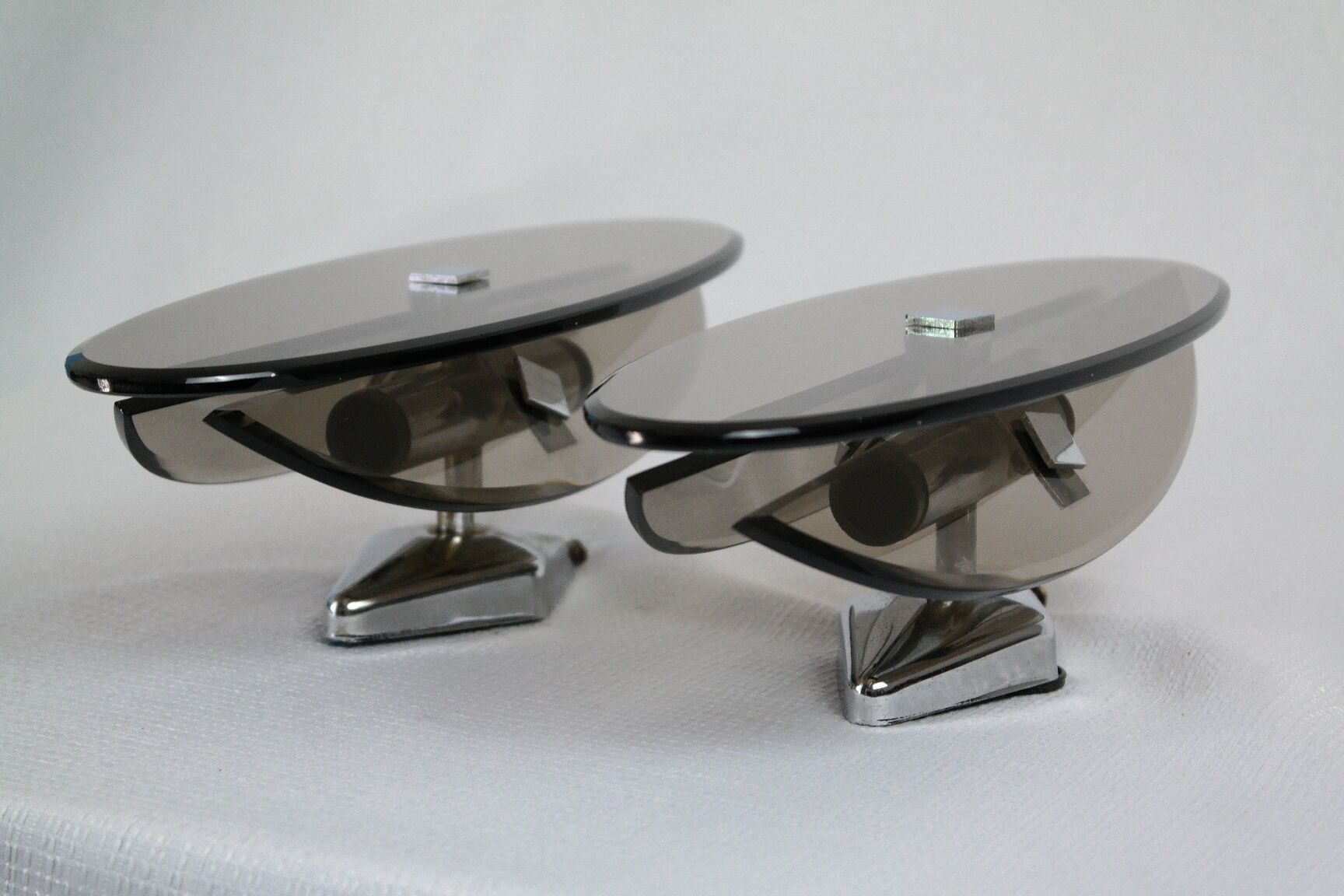 Pair of smoked glass and vintage chrome wall lamps