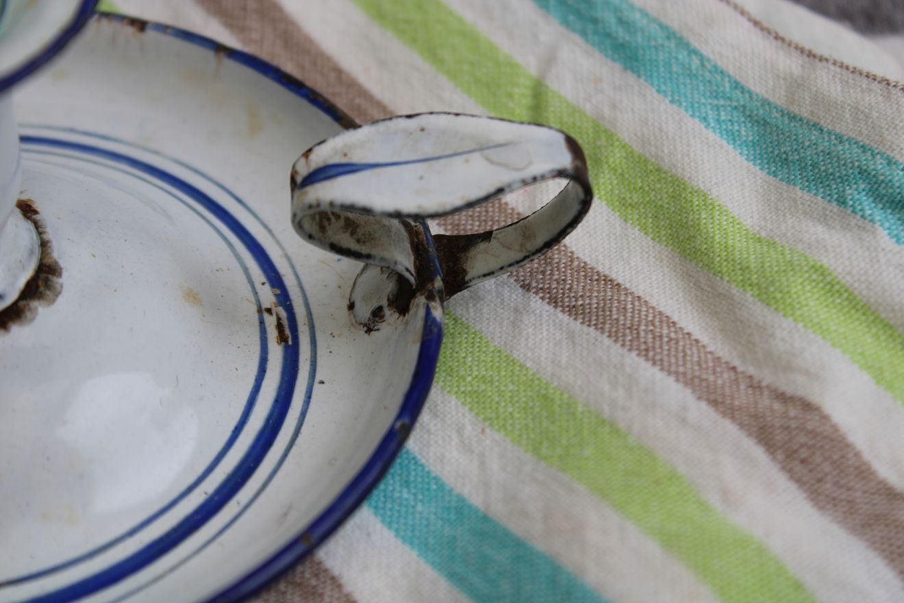 Old enamel candle holder