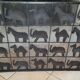 Black metal firewall decorated with animals