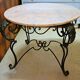 marble and wrought iron coffee table