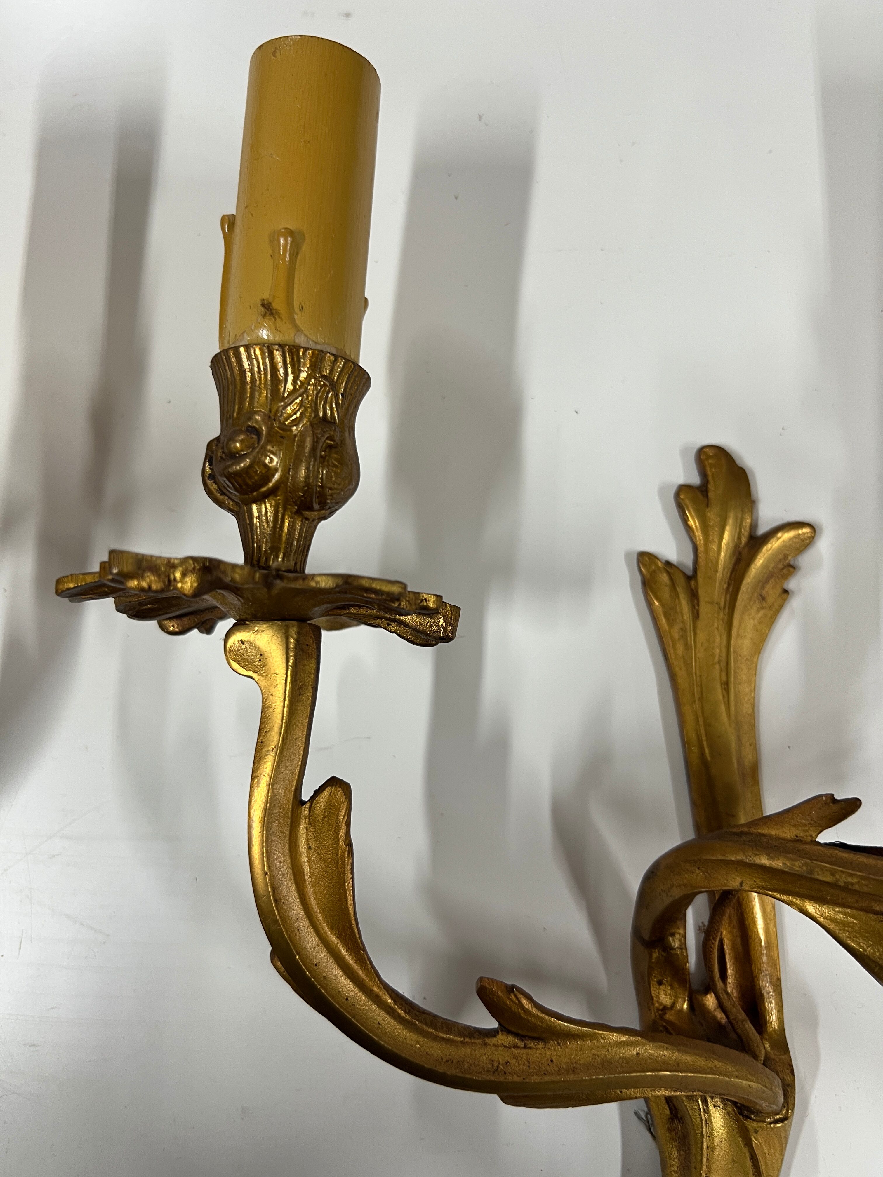 Pair of Louis XV wall lamps in gilded bronze