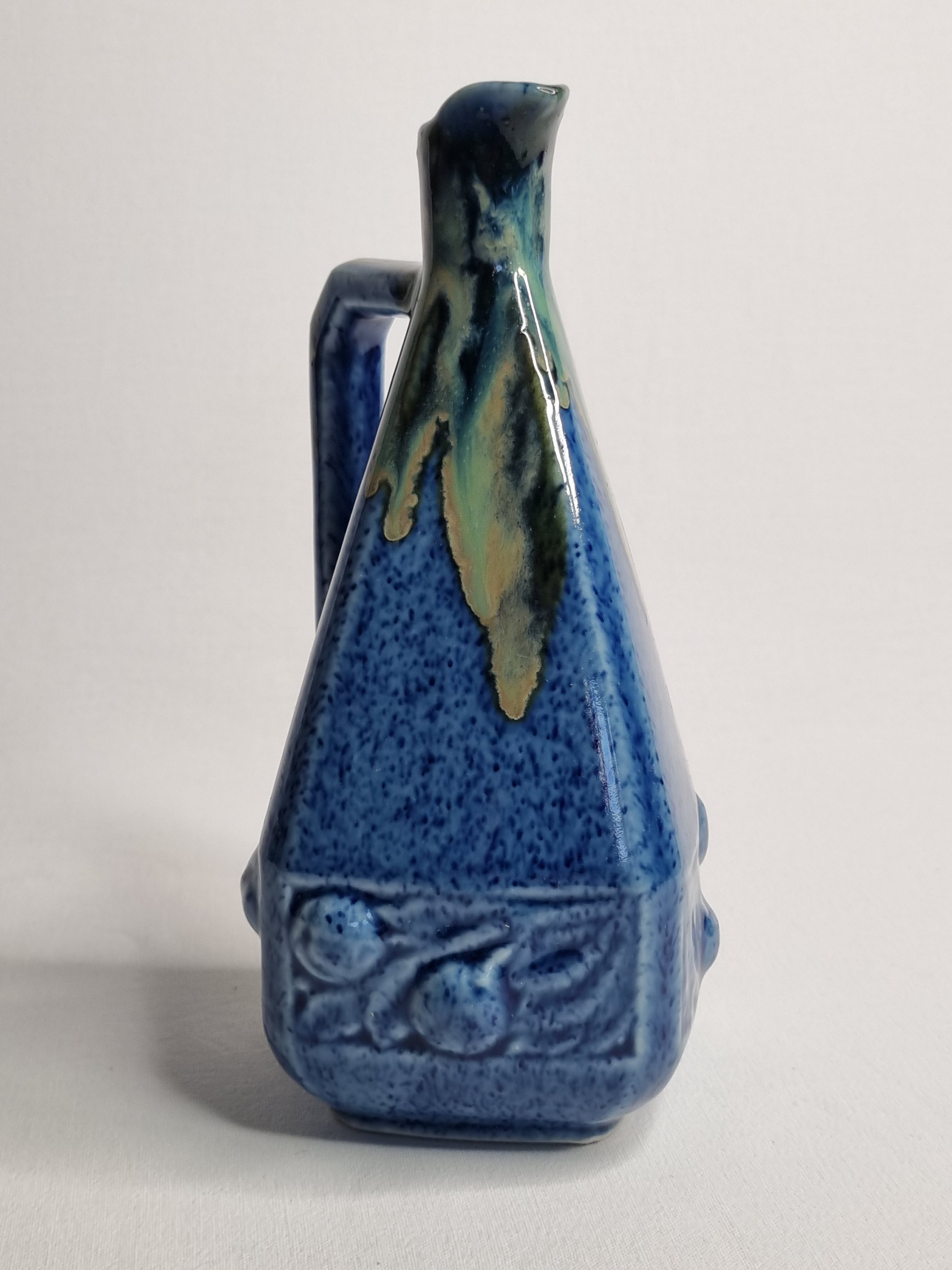 Art Deco pitcher in blue enamelled sandstone with fruit decoration, 22 cm