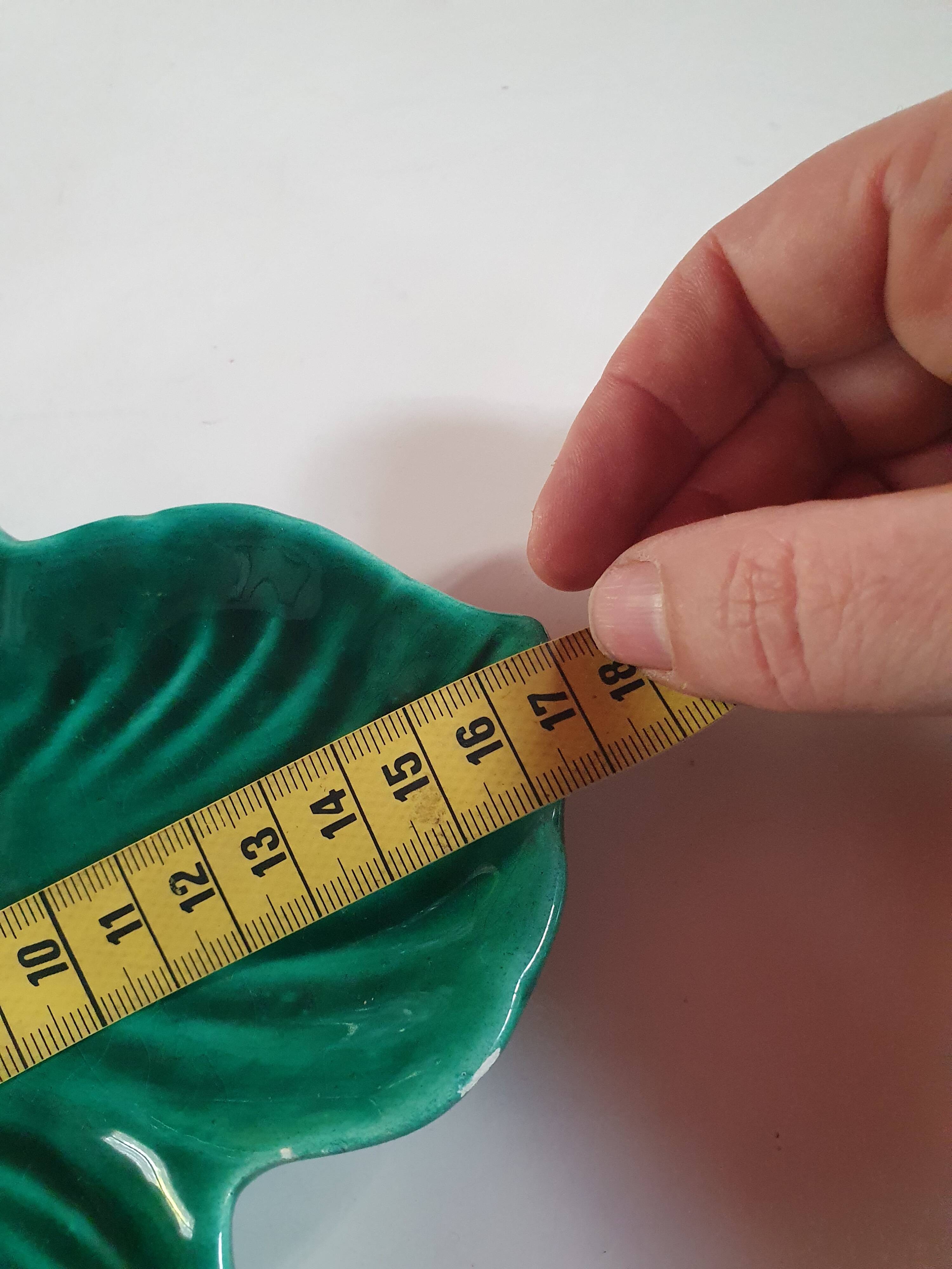 empty pocket cup leaf shape green ceramic slip, some chips on one edge