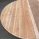 Round dining table with a central pedestal, extendable, stripped in solid walnut with 2 extensions.