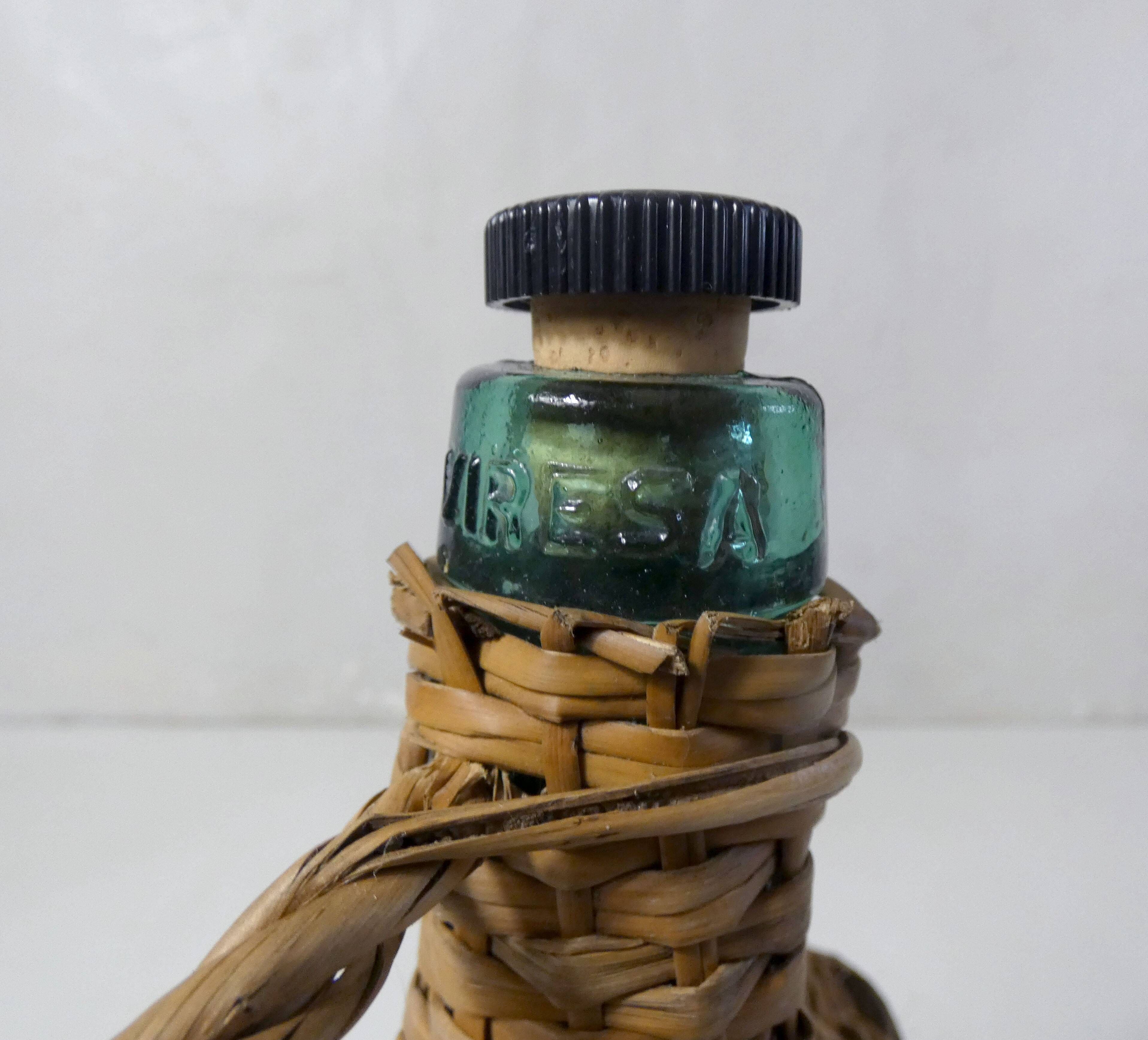 old bottle dressed in rattan vintage pilgrim gourd