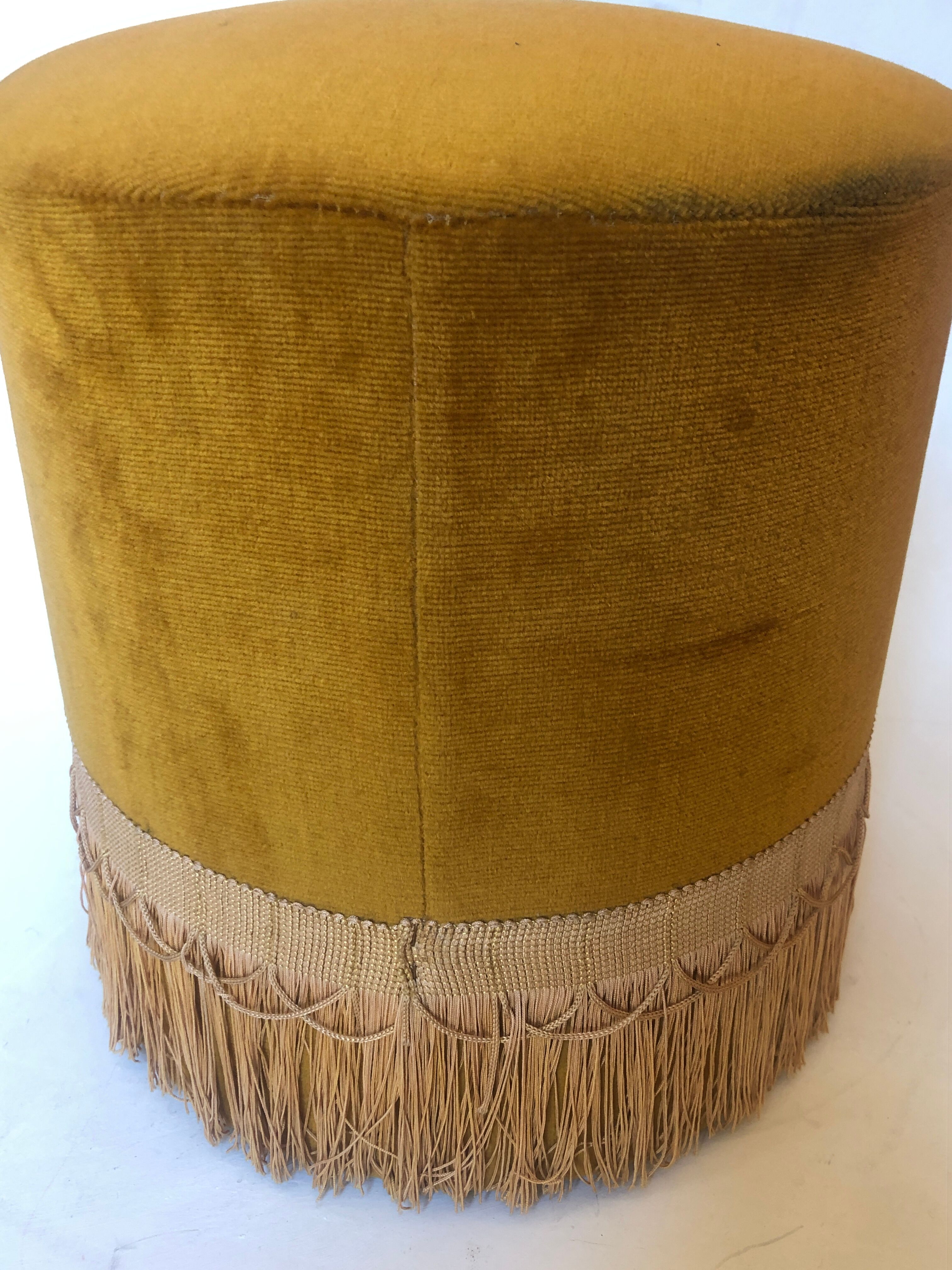 Velvet and fringed ottoman