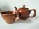 Vintage caramel brown enamel teapot and cup duo from the 70s