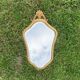 Antique beveled wall mirror in gilded solid wood