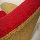 Red and mustard yellow fabric armchair in 1970s style