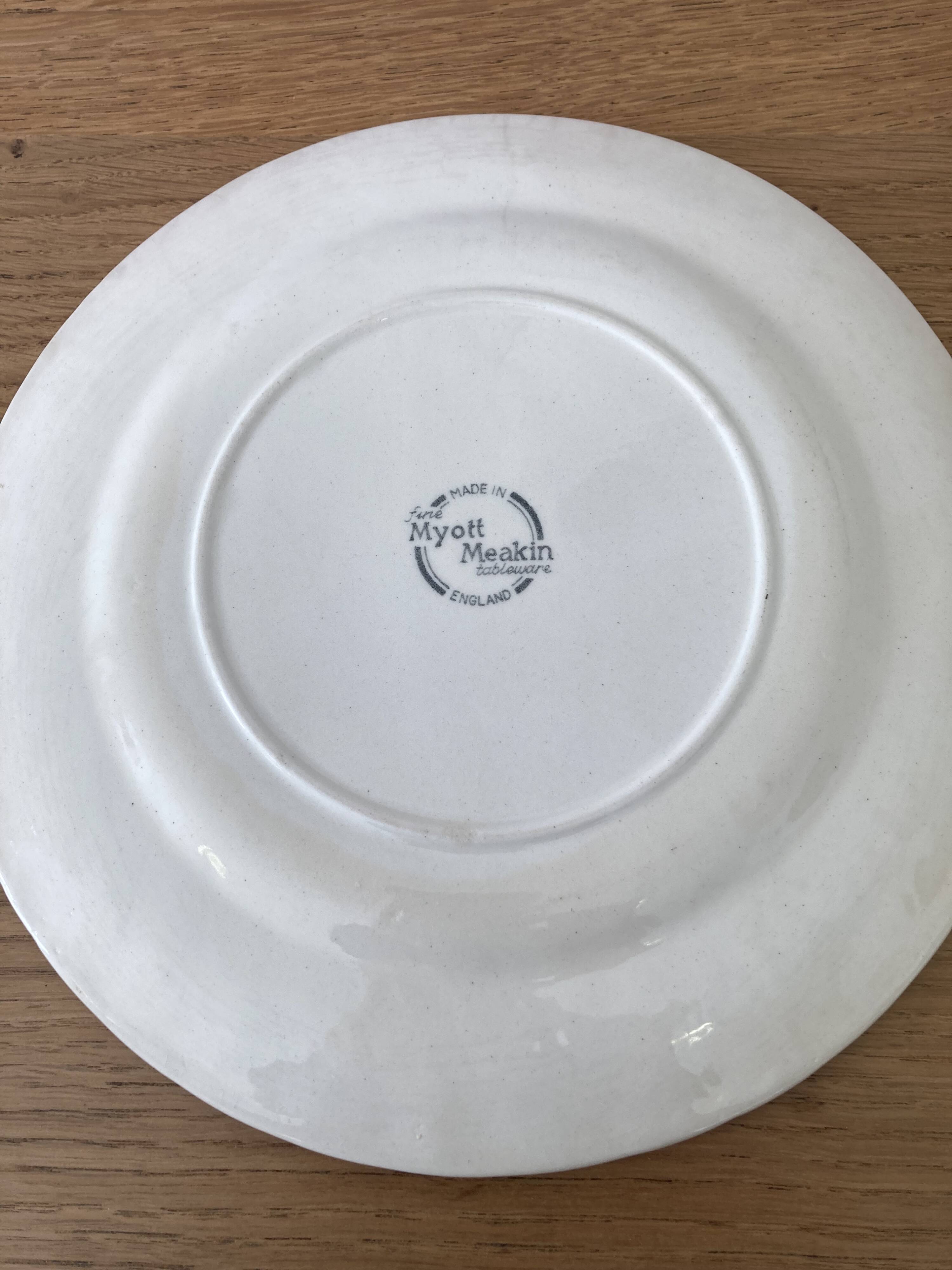 Four old blue plates