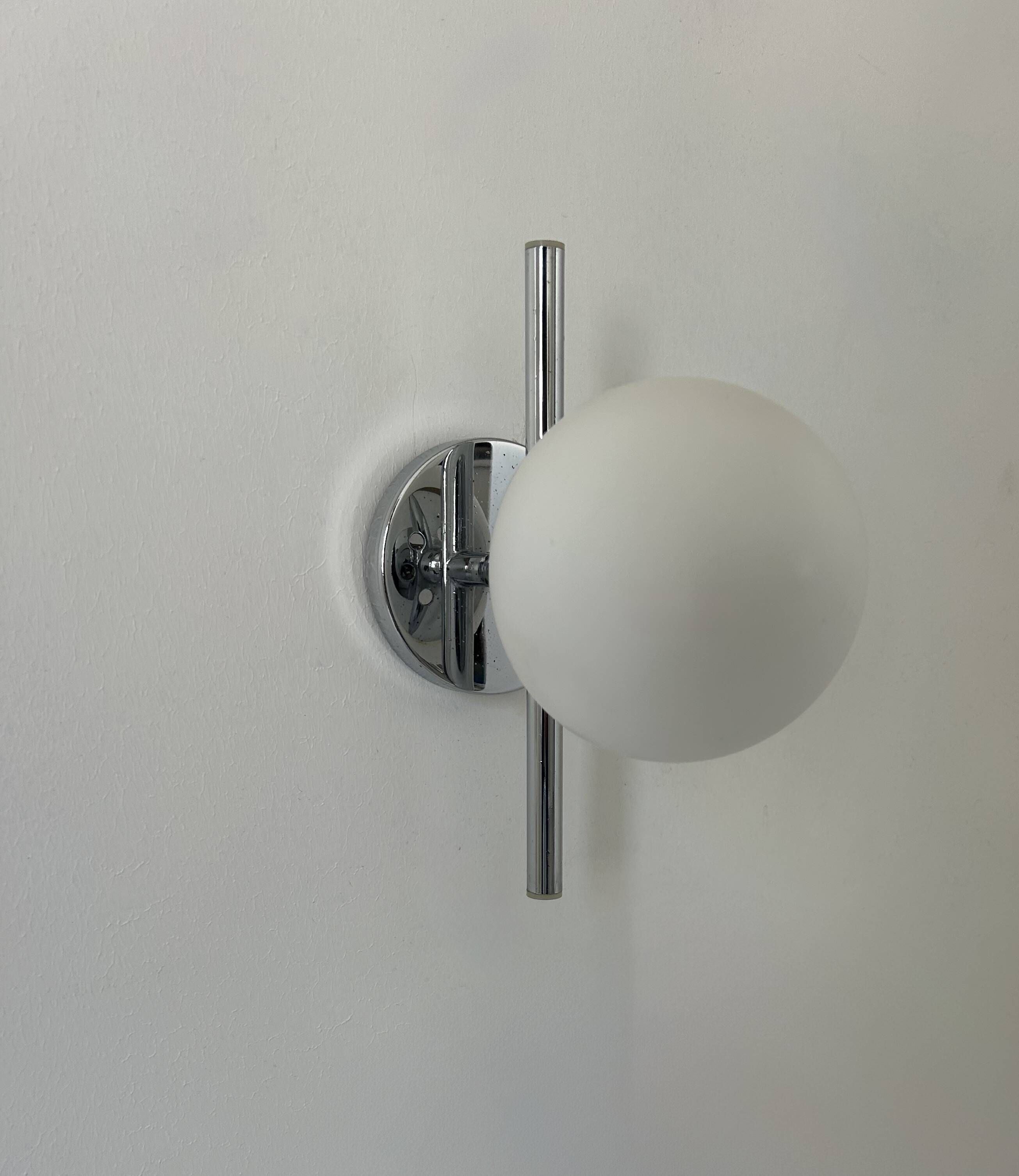Pair of vintage chrome and opaline wall lights, France 1970.