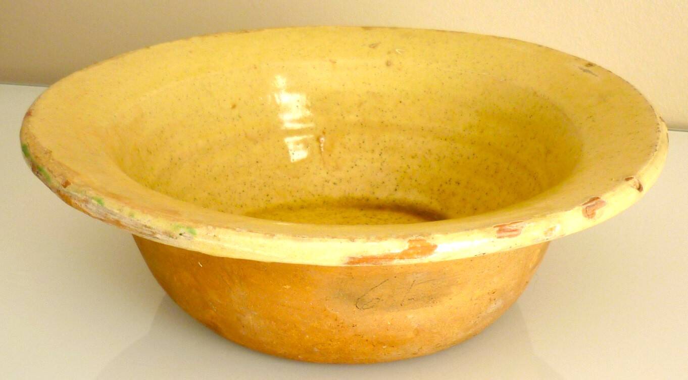Frying pan, old caquelon, yellow glazed earthenware from the south of France.