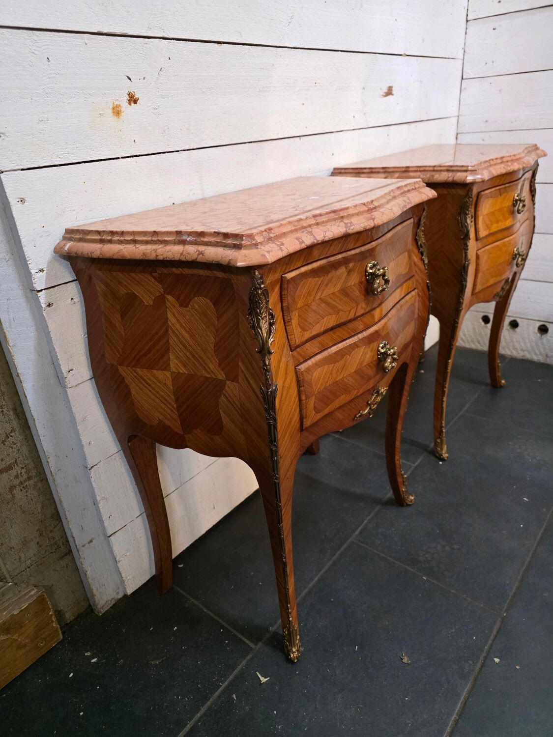 Pair of Louis XV style curved bedside tables in marquetry