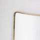 Pair of narrow gilt brass mirrors. Circa 1970.