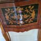 Louis XV bedside table or gueridon with floral motifs, 19th century.