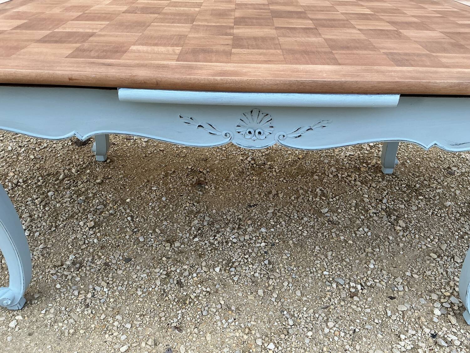 Louis XV style walnut table with a natural wood top.