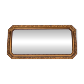 Horizontal French mirror in a gold frame.