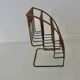 Raoul Guys rattan and metal magazine rack from the 50s
