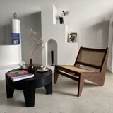 Reclined armchair in canned teak in natural wood