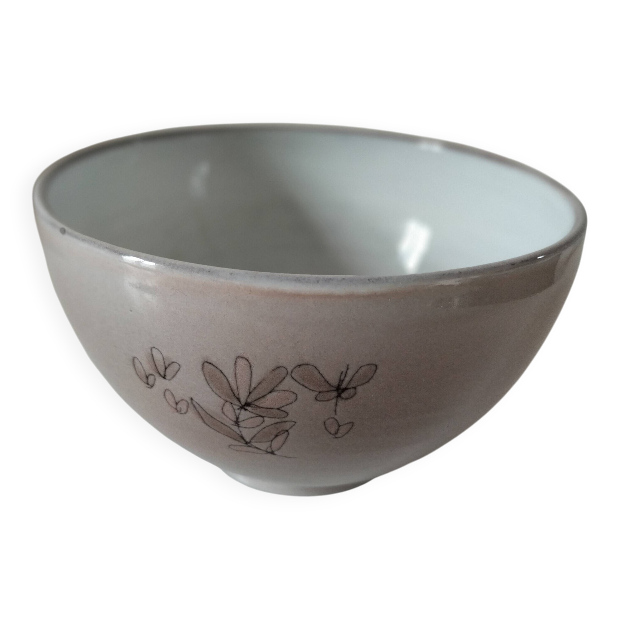 Glazed earthenware bowl, Millian pottery, France, stylised floral decoration.