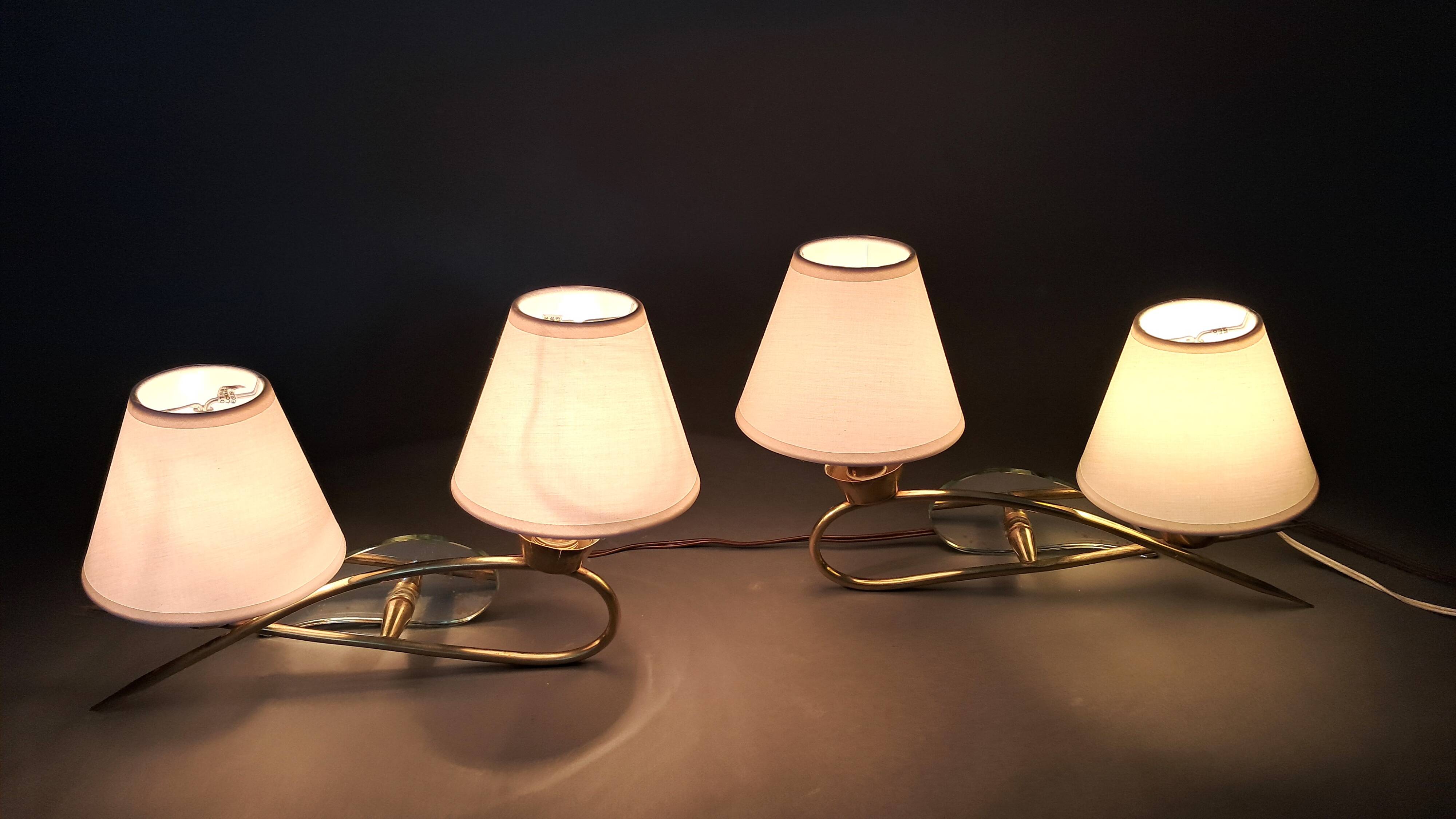 Pair of gilded brass and mirror wall lights, Circa 1960.